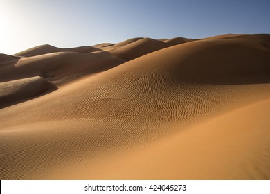 Sand dunes of Liwa desert at sunrise in Abu Dhabi, United Arab Emirates. - Powered by Shutterstock