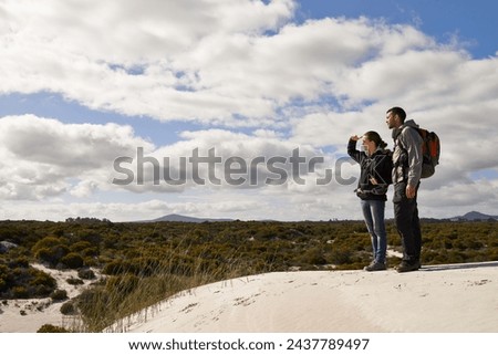 Similar – Image, Stock Photo Young couple taking a walk near the coast