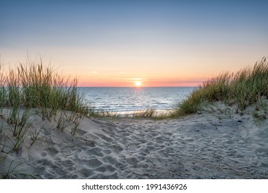 Sand dunes on the beach at sunset - Powered by Shutterstock