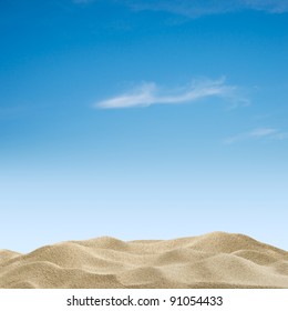 Sand Dunes On Blue Sky Background