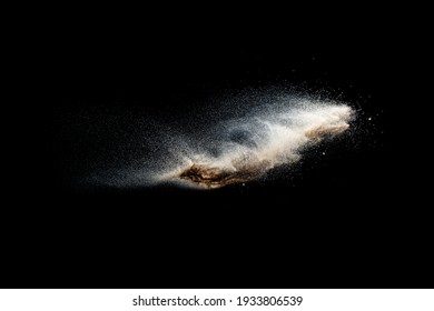 Sand Explosion Isolated On Black Background. Freeze Motion Of Sandy Dust Splash.