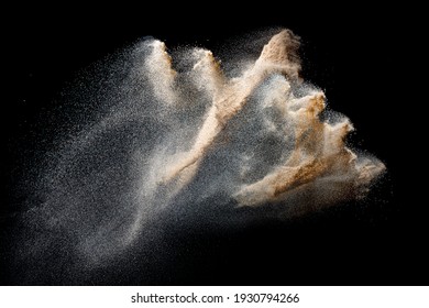 Sand Flying Explosion Isolated On Black Background. Freeze Motion Of Sandy Dust Splash.