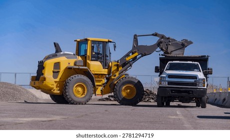Sand loading process with front loader and dump truck
