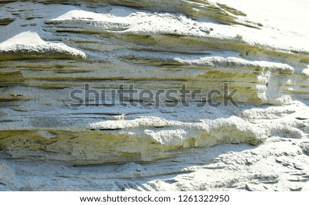 Sand mass in sandpit. Sand quarry in open pit mine. Sandy texture background. Mineral, building material, construction. Nature, geology, ecology, environment