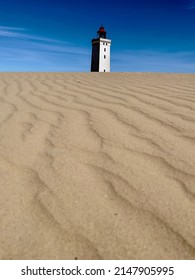 Sand And Old Light House In Denmark