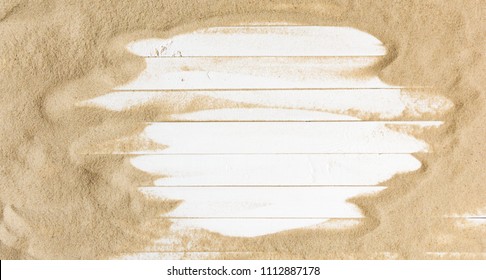 Sand on a  white planked wood. Summer background. Flat lay, top view, copy space - Powered by Shutterstock