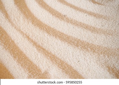Sand pattern in Japanese zen garden, wavy lines, sand texture