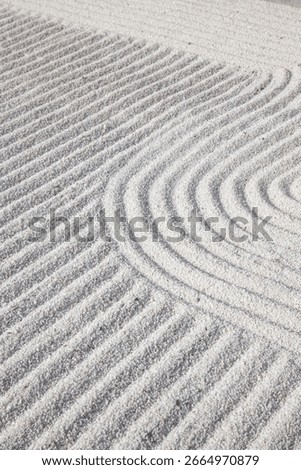 Sand patterns. Patterns formed on small white stone chips. Landscape design background. Selective focus.
