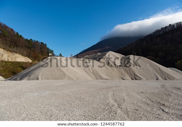 sand pit in the mountains, the\
mountains of sand, the trail from the tires of a large\
car