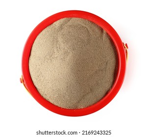 Sand in plastic bucket isolated on white, top view - Powered by Shutterstock