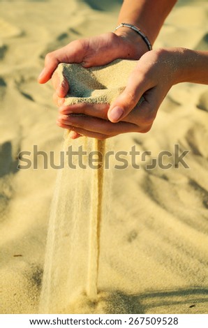 Similar – Hand im Sand Lifestyle