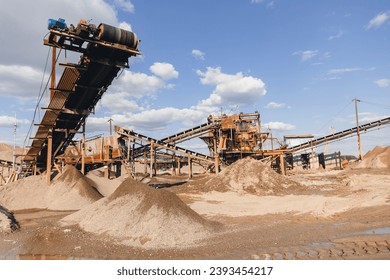 Sand quarry factory banner, Industrial plant with belt conveyor in open pit mining with Industry excavator on construction site. - Powered by Shutterstock