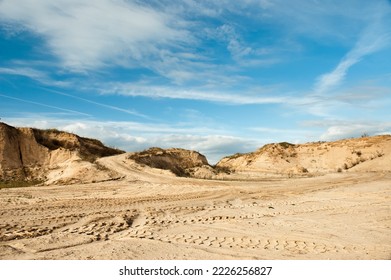 sand quarry, in the photo, a quarry for the extraction of sand against a blue sky.