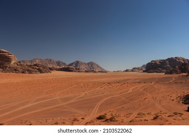 Sand and Rock Formation Desert Scene in Wadi Rum, Jordan - Truck Tire Road Marks