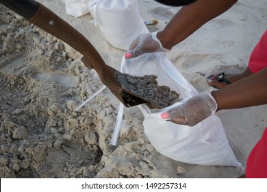  Sand Is Shoveled Into A Free Sandbag Provided By The City Of Miami Garden In Preparation For Hurricane Dorian.