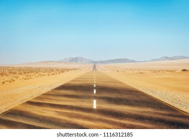 Sand Storm Across Lonely Desert Road in Southern Namibia taken in January 2018 - Powered by Shutterstock