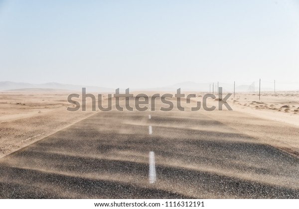 Sand Storm Across Lonely Desert Road in\
Southern Namibia taken in January\
2018