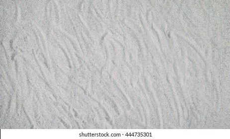 Sand texture. Gray sand. Background of fine sand. Sand background.
 Close up view of a sandy background. - Shutterstock ID 444735301
