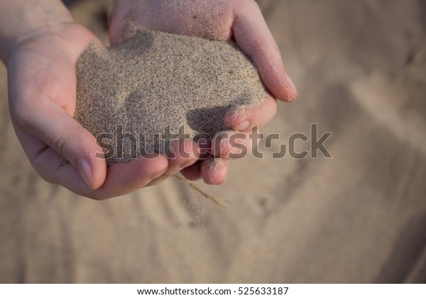 Sand Through Fingers Stock Photo (Edit Now) 525633187