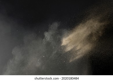 Sand thrown with sand dust and fine particles