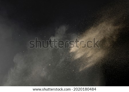 Sand thrown with sand dust and fine particles