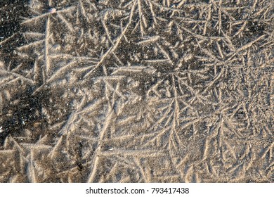 A sand and water texture with twists and lines. Baltic sea, Latvia - Shutterstock ID 793417438