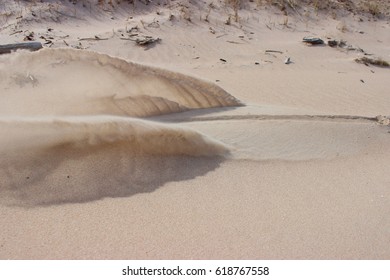 Sand waves as result dragging stick along the ground  Stop motion shock wave 