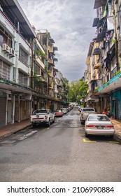 Sandakan, Malaysia - January 06, 2022: Cityscape of the in Borneo. Rundown houses and old Malaysian cars on the street. Second largest city of Sabah and formerly known as Elopura. City view Sandakan