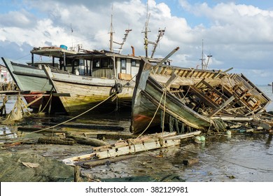 SANDAKAN,SABAH - DEC 27, 2015 : Abandoned fishing boat near pantai Pasir Putih, Sandakan,Sabah. Sandakan main economic activities include fishing, ship building, eco-tourism, and manufacturing. 