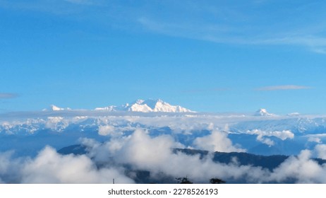 From Sandakphu, the snow-capped Kanchunjunga and it's congregation of smaller peaks are distinctly visible all the year round. The formation resembles the head, face, upperbody and feet of Lord Buddha