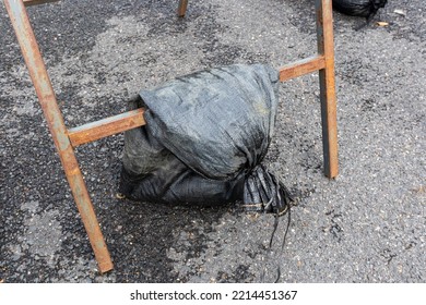 Sandbag Used To Weigh Down A Frame Displaying A Temporary Road Sign