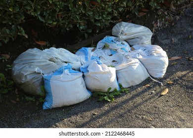 Sandbags For Flood Control. Measures To Prevent Flooding Of Houses.