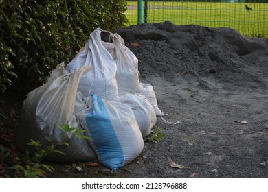 Sandbags For Flood Control. Measures To Prevent Flooding Of Houses.