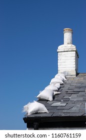 Sandbags On The Roof To Protect Against Wind Or Hurricane