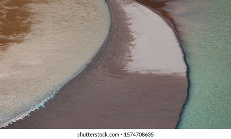 A Sandbar Formed By Sediment Deposits At The Bend Of A River