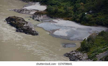 A Sandbar Formed By Sediment Deposits At The Bend Of A River