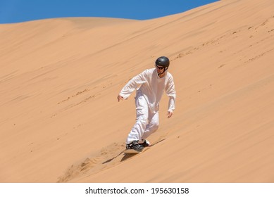 Sandboarder in action, Africa, Namibia - Powered by Shutterstock