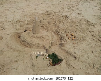 Sandcastle With Mini Stone Henge And Moat