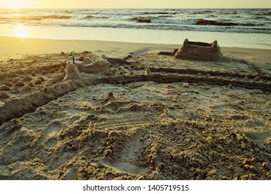 Sandcastle With Moat On The Baltic Beach At Dusk. Summer Vacation, Leisure Activity. Pomerania, Poland.