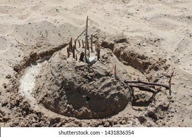 Sandcastle With Moat On The Beach.