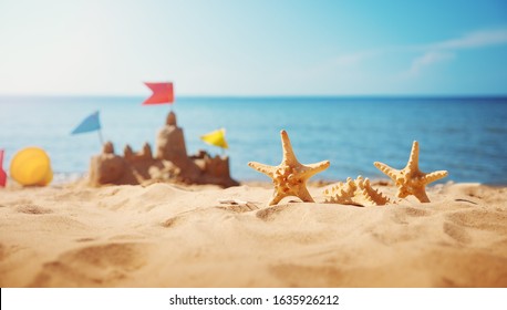 Sandcastle on the beach at sea in summertime - Powered by Shutterstock