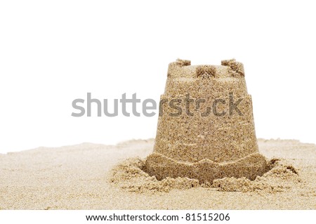a sandcastle on the sand on a white background