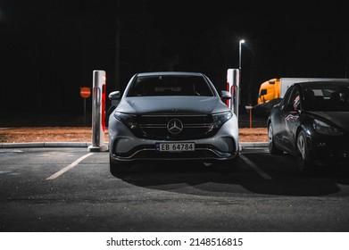 Sandefjord, Norway - februar 25, 2022: Silver Mercedes EQC Parked At Tesla Supercharger Station. The Mercedes EQC Is A Full-sized All-electric Five-door SUV
