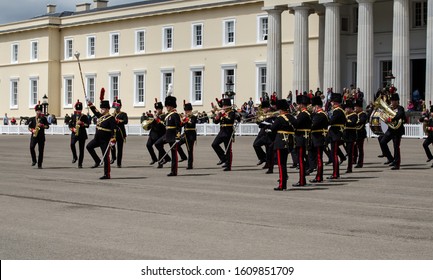 Sandhurst, Berkshire, UK - June 16, 2019: The Drum Major Directing Musicians Of The Royal Artillery Band At A Performance In Front Of Old College At The Sandhurst Military Academy On A Summer Day.