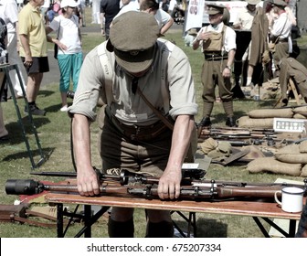 Sandhurst, UK - 18th June 2017: Vintage toned shot of an enthusiast demonstrating a Lee Enfield Rifle Grenade Launcher at a military enactment fair