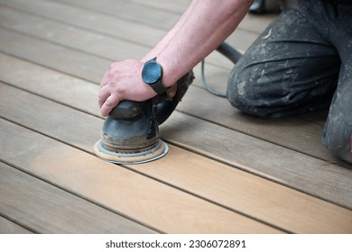 Sanding process of wooden terrace floors. Sanding machine remove imperfections. - Shutterstock ID 2306072891