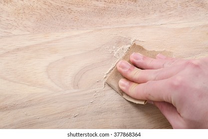 Sanding and smoothing wood with sandpaper. - Powered by Shutterstock