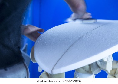 Sanding/ A Surfboard Maker Sands A Foam Core Into Shape