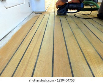 Sanding Teak Deck On The Yacht