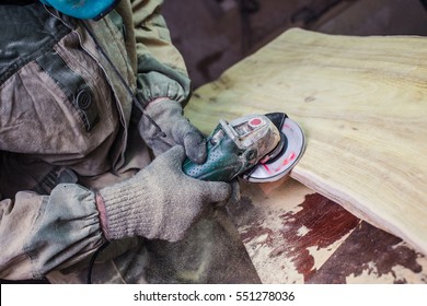 Sanding wood sander. A man working with grinder. Sawdust flew from under the wheel.
Polished light wood after manufacture.  - Powered by Shutterstock